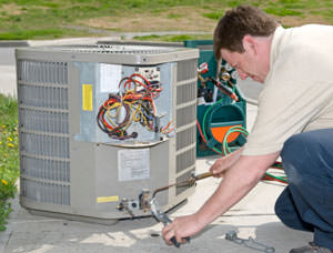 A contractor installing a unit in Cumming