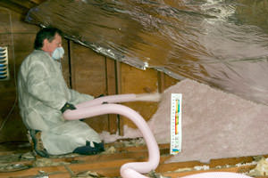 Fiberglass Insulation being used to add energy efficiency to an attic in Altoona