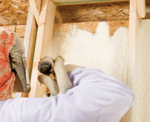 Spray foam insulation being installed by a certified professional in Iowa