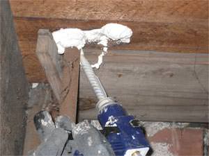 installing spray foam insulation on a rim joist in West Des Moines